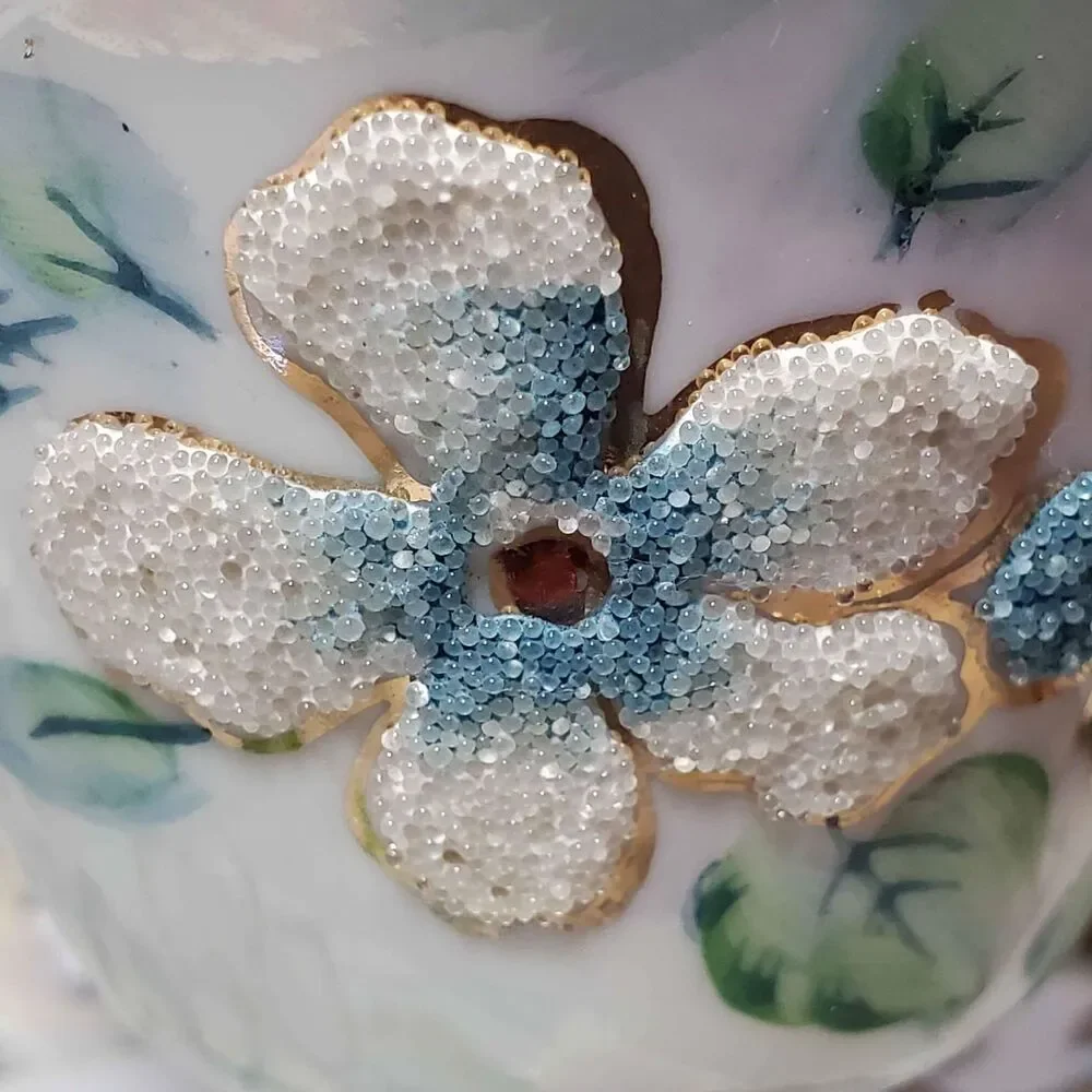 EFCCO Teacup and Saucer Blue White Textured Flowers Reticulated Opalescent